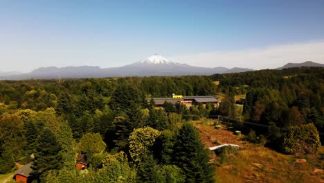 Aerial-shot-of-forest-and-volcano-Villarica,-Chile