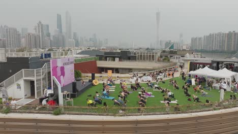 Women-doing-yoga-exercise-at-the-city-building-rooftop-open-air