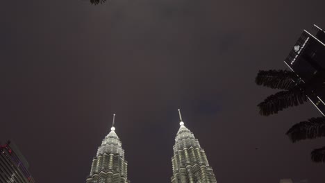 KLCC-Malaysia-tilt-shot-at-night-Petrona-twin-towers-background-and-fountains-Kuala-Lumpur