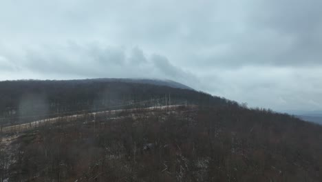 Drone-flight-approaching-mountain-in-the-winter
