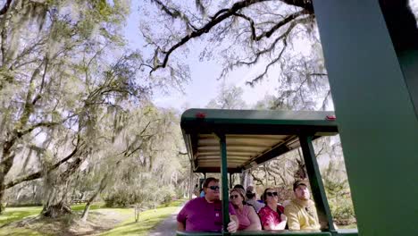 tourist-tour-magnolia-gardens-on-a-tram-under-live-oaks