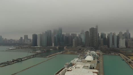 Navy-Pier-Chicago,-IL-with-fog-and-light-snow-drone-flying-in