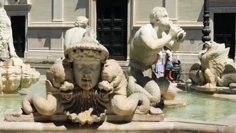 Detail-of-the-the-tritons,-dragons-and-masks-of-the-Moor-Fountain-,-Piazza-Navona,-Rome,-Italy