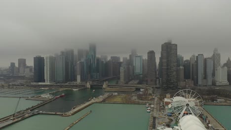 Navy-Pier-Chicago,-IL-with-fog-and-light-snow-drone-coming-down
