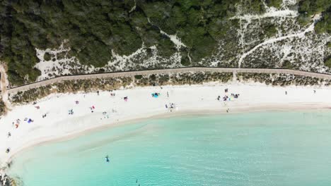 Aerial-views-of-the-white-sand-of-Son-Saura-virgin-beach-in-Menorca-Beach,-Spain