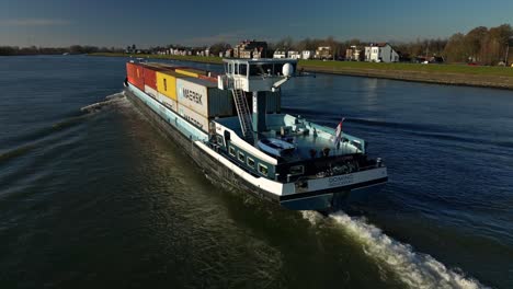 Cargo-Inland-Ship-Transporting-Containers-Across-The-River-In-Netherlands