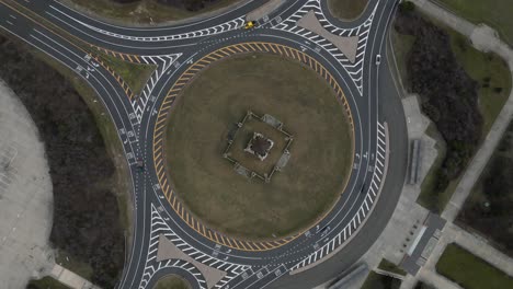 An-aerial-view-high-over-a-roundabout-on-Long-Island,-New-York-on-a-cloudy-day