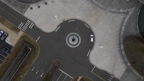 A-top-down-view-directly-over-an-office-building-vehicle-roundabout