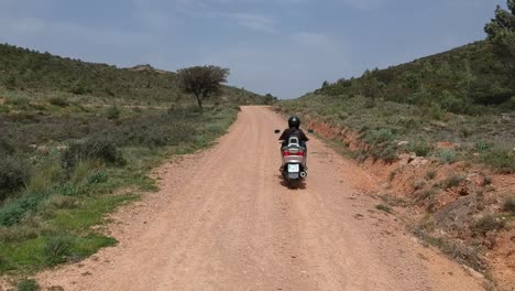Riding-a-motorbike-through-an-arid-countryside-in-southern-Spain