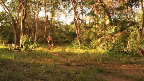 Indigenous-fisherman-bicycling-home-after-catching-fish-in-the-Amazon-River