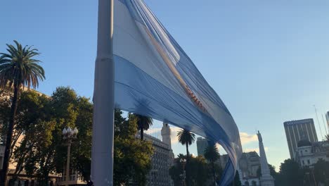 Lowering-the-national-Argentine-flag-at-the-end-of-the-day-at-Casa-Rosada---waving-in-the-wind