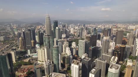 Panning-shot-of-Kuala-Lumpur-and-Petronas-towers-from-the-sky