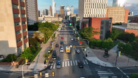 Aerial-tracking-shot-of-ambulance-on-city-street-in-Philadelphia,-Pennsylvania