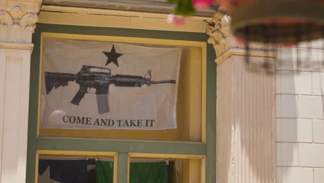 A-Flag-that-says-"Come-and-Take-It,"-with-an-AR-15-Rifle-on-it