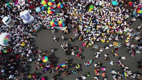 Aerial-view-of-LGBT-Gay-Pride-Parade-and-Festival-celebrations---top-down,-drone-shot