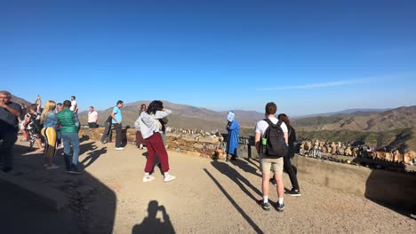 Tourists-and-travellers-standing-on-Atlas-Mountain-viewpoint-in-Africa