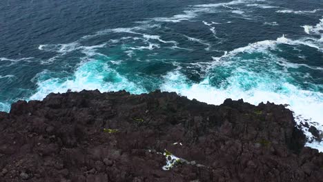 Rugged-Coastal-Sea-Cliffs-In-Miradouro-da-Ponta-do-Queimado,-Terceira-Island,-Azores---aerial-pullback