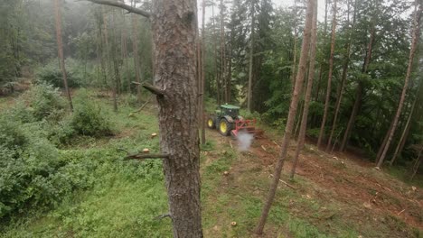 Drone-shot-of-a-forestry-mulcher-in-the-forest-after-a-bark-beetle-infestation