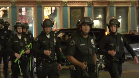 Riot-police-deploy-down-street