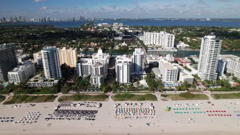 Drone-shot-of-Miami-skyline-from-Miami-Beach,-beachfront-hotels-and-resorts