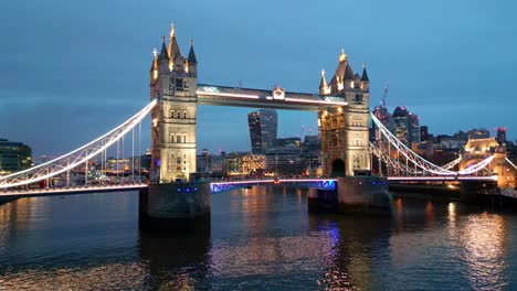 Orbital-drone-shot-of-the-Tower-Bridge-in-London,-England,-at-night