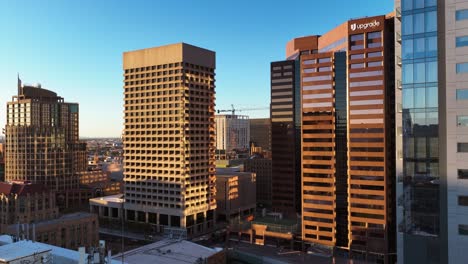Aerial-view-towards-the-Well-Fargo-and-Upgrade-buildings,-sunny-evening-in-downtown-Phoenix,-USA
