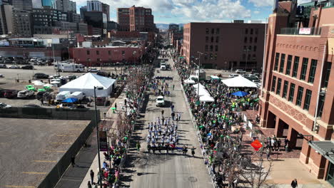 Overhead-view-of-a-marching-band-walking-the-downtown-streets-of-Denver-in-the-middle-of-the-St