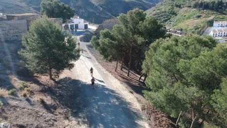 People-running-a-mountain-marathon-on-arid-roads