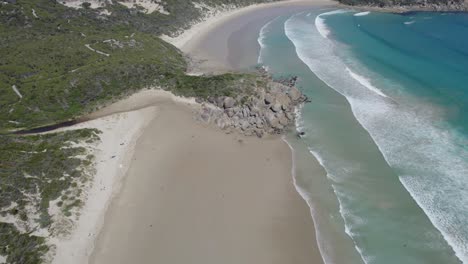 Picnic-Bay-With-White-Sandy-Shore-And-Turquoise-Water-In-Australia---aerial-drone-shot