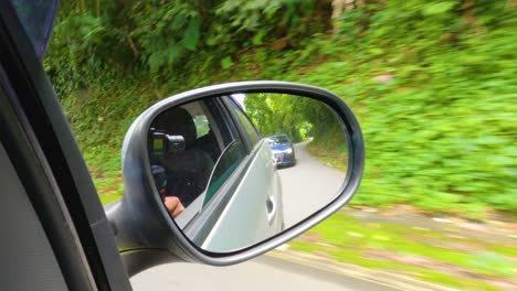 Filming-the-rear-view-of-the-car-in-motion-on-a-road-in-Angra-dos-Reis