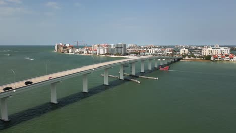 Aerial-Drone-Flying-Over-Clearwater,-Florida-Bridge-on-Sunny-Day