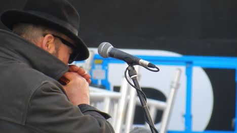 Intercity-blues-band-singer-with-harmonica,-Singing-on-Liverpool-street-performance