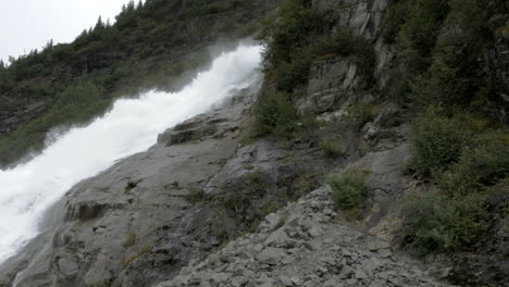 A-waterfall-runs-down-an-Alaskan-mountainside-in-slow-motion
