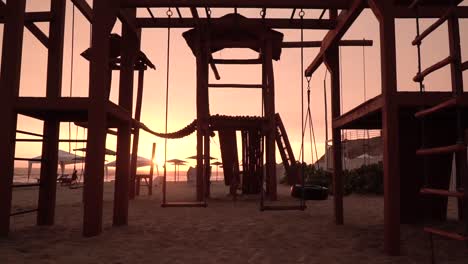 Playground-on-a-beach-during-sunset-in-Punta-Rocas,-Lima,-Peru