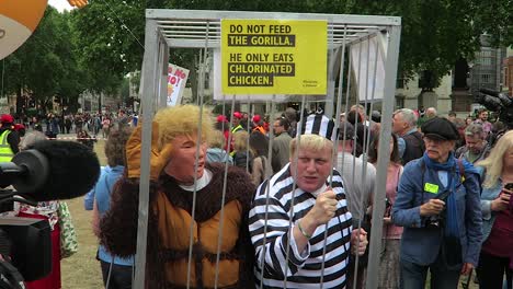 Boris-Johnson-character-Along-With-Donald-Trump-character-Talking-In-Cage-During-President-Donald-Trump's-State-Visit-to-the-UK