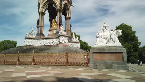 The-Albert-Memorial-in-Kensington-Gardens-and-near-the-Royal-Albert-Hall,-commissioned-by-Queen-Victoria,-London,-UK