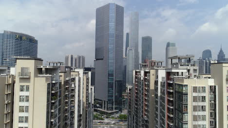 Guangzhou-downtown-living-block-with-CBD-office-buildings-in-background-on-a-sunny-day-in-the-afternoon