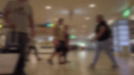Unfocused-static-shot-of-people-walking-in-an-airport