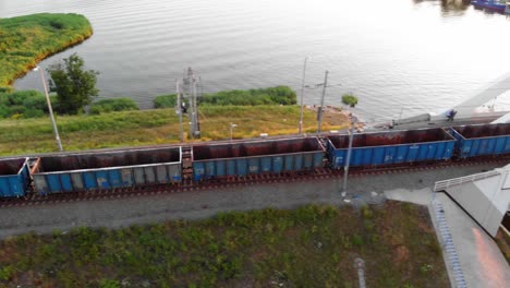 Train-With-empty--Cargo-Containers-Moving-Down-Tracks