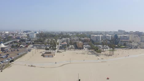 Aerial-pan-over-Santa-Monica-beach-on-a-Summer-morning