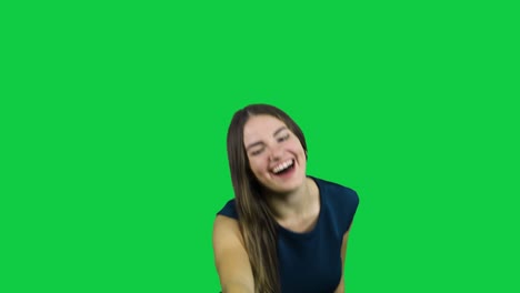Girl-making-fun-out-of-something-in-front-of-a-green-screen