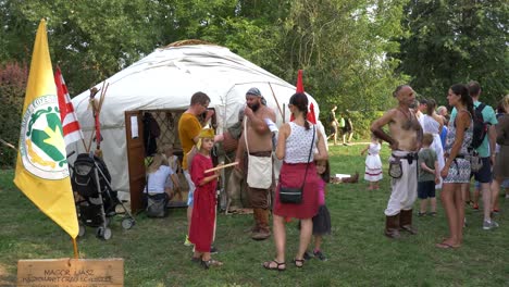 Savaria-carnival,-Medieval-camp,-people-talking-with-historical-characters
