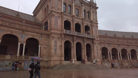 Tilt-Down,-landmark-Plaza-de-Espana-main-building-in-Seville,-Spain-on-rainy-day