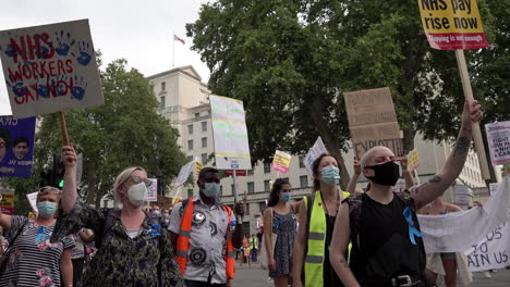Hundreds-of-National-Health-Service-staff-and-key-workers-rally-outside-Downing-Street-in-Whitehall-holding-various-placards-and-chanting-on-the-Pay-Justice-social-distancing-protest