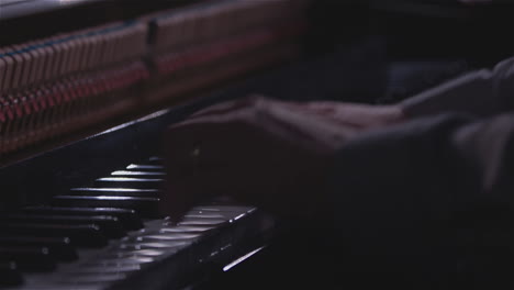 Hands-and-fingers-playing-open-piano