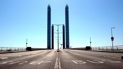 Jacques-Chaban-Delmas-Bridge-in-Bordeaux-France-with-single-car-during-the-COVID-19-pandemic,-Locked-center-shot
