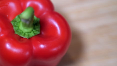 Red-Bell-Pepper-On-A-Chopping-Board,-COPY-SPACE