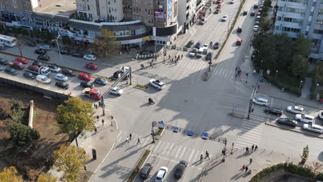 High-Angle-Shot-of-Busy-Traffic-at-Road-Intersection-on-Sunny-Day
