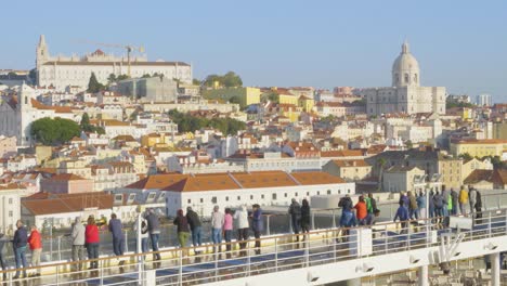 A-view-of-a-town-near-the-port-of-Valencia-from-a-cruise-ship-with-tourists,-Spain