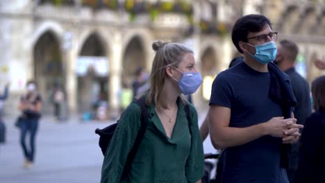 Slow-motion-closeup-of-man-and-woman-with-face-mask